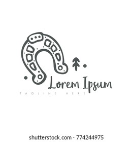 Horse shoe and tree logo.Perfect for antique shop, unique company logo, lucky charm, uncommon, whimsical and quirky.