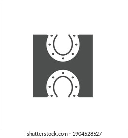 Horse shoes and letter H 