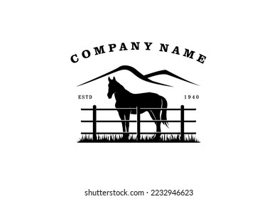 Horse silhouette behind wooden fence paddock for vintage retro rustic countryside western country farm ranch logo design