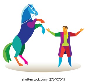 The horse stands on its hind legs in front of the trainer in the circus arena