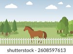 A horse stands peacefully in a field behind a white fence