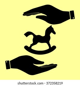 Horse toy sign. Save or protect symbol by hands.