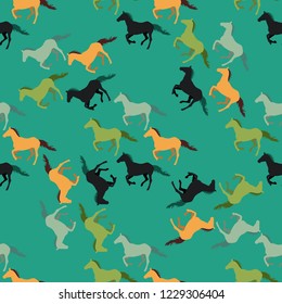Horses in non realistic colors run at a trot and gallop. Seamless vector pattern of running horses. Silhouettes of animals arranged randomly. For wrapping paper, prints on clothes, covers