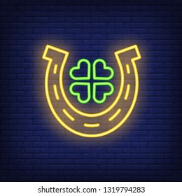 Horseshoe and clover neon sign. Saint Patricks Day design. Night bright neon sign, colorful billboard, light banner. Vector illustration in neon style.
