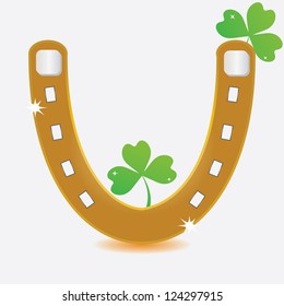Horseshoe and four leaf clover.vector