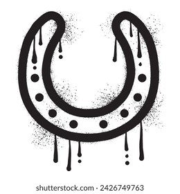 Horseshoe graffiti drawn with black spray paint