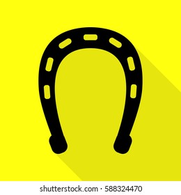 Horseshoe sign illustration. Black icon with flat style shadow path on yellow background.