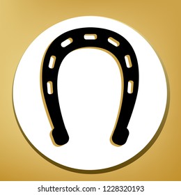 Horseshoe sign illustration. Vector. Black icon with light brown shadow in white circle with shaped ring at golden background.