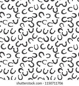 Horseshoe vector seamless pattern. Horse shoe silhouette as international good luck symbol. Endless background with fortune and success signs