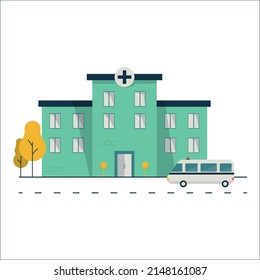 hospital building by the road with an ambulance