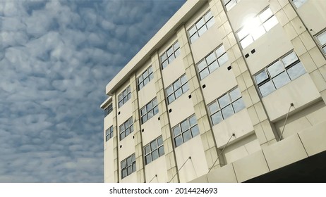A hospital building with lots of glass windows against a beautiful sky background.