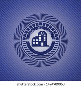 hospital icon inside badge with denim background