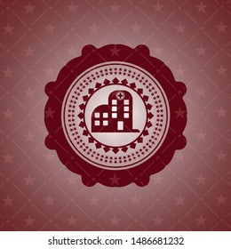 hospital icon inside badge with red background