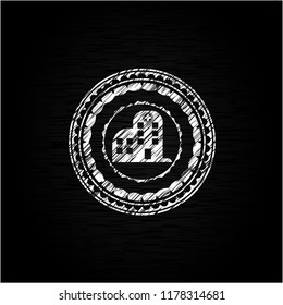 hospital icon inside chalkboard emblem written on a blackboard