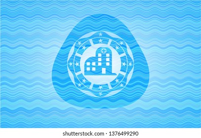 hospital icon inside light blue water wave style emblem.