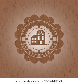 hospital icon inside realistic wooden emblem
