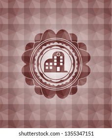 hospital icon inside red seamless badge with geometric pattern background.