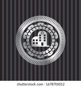 hospital icon inside silvery emblem