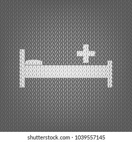 Hospital sign illustration. Vector. White knitted icon on gray knitted background. Isolated.