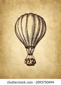 Hot air balloon. Aerostat ink sketch on old paper background. Hand drawn vector illustration. Retro style stroke drawing.