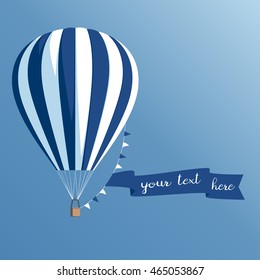 Hot air balloon with a banner on a blue background, striped hot air balloon with ribbon and flags flying in the sky