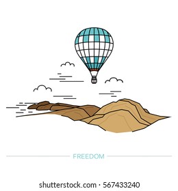 Hot air balloon in clouds on a background of mountains. Travel concept.