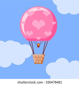 Hot air balloon decorated with hearts in the air