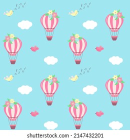 Hot air balloon with flowers, clouds and cute birds seamless pattern. Vector illustration.