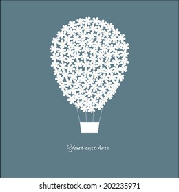 Hot air balloon with flowers in the sky. Vector illustration.