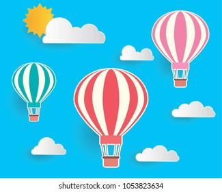 Hot air balloon flying on the sky with cloud and sun. Paper art style