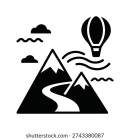 A hot air balloon flying over a mountain range