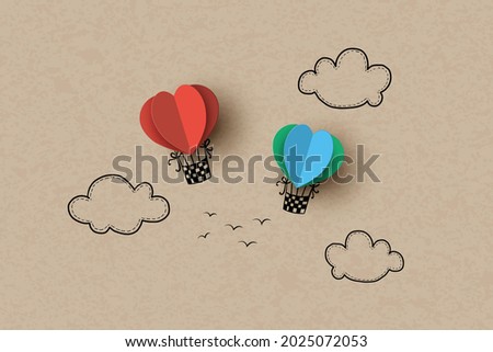 Hot air balloon in a heart shape on sky. Hand drawing and papercut.