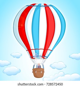 hot air balloon in red, white and blue colors flying in the sky