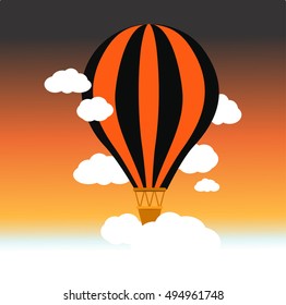 Hot air balloon in the sky black and orange