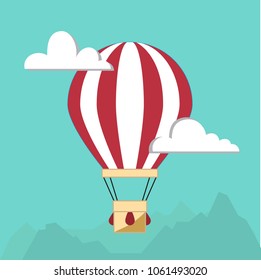Hot air balloon in the sky with clouds and mountains. Flat cartoon design. Vector graphic illustration