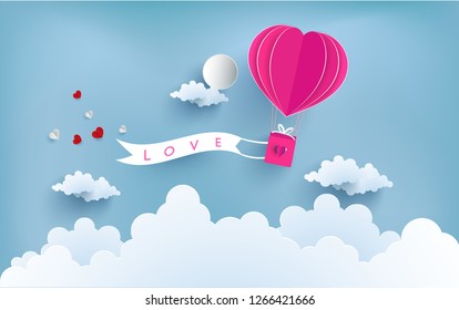 Hot air balloons carry love banners flying on clouds of paper art designs. happy valentine's day