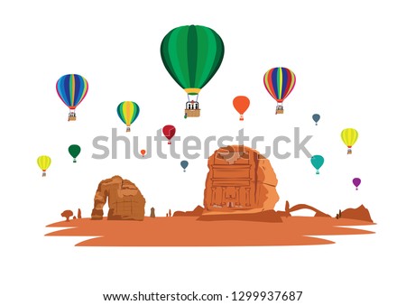 Hot Air Balloons Fly Over the Rock formations, Qasir Al Farid in Madain Saleh and Elephant Rock located in the desert of Saudi Arabia's Al Ula county