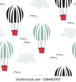 Hot air balloons fly in the sky seamless pattern. Vector hand drawn illustration.