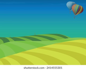 Hot air balloons flying over multi colored flower fields landscape, high angle view.