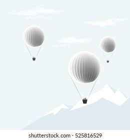 Hot air balloons. Balloons flying over ice mountains.