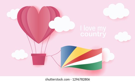 Hot air balloons in shape of heart flying in clouds with national flag of Seychelles. Paper art and cut, origami style with love to Seychelles