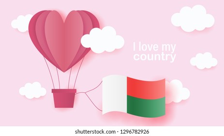 Hot air balloons in shape of heart flying in clouds with national flag of Madagascar. Paper art and cut, origami style with love to Madagascar