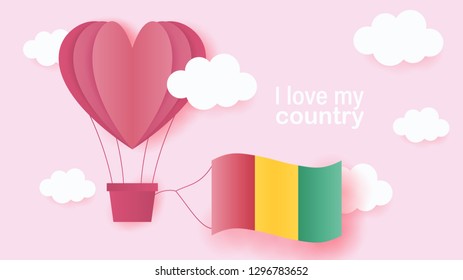 Hot air balloons in shape of heart flying in clouds with national flag of Guinea. Paper art and cut, origami style with love to Guinea