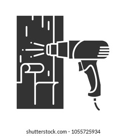 Hot air gun heating surface glyph icon. Paint removing. Silhouette symbol. Negative space. Vector isolated illustration