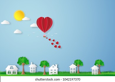 The hot air heart balloon, sun and countryside on blue sky as love, happy valentine's day, wedding and paper art concept. vector illustration.