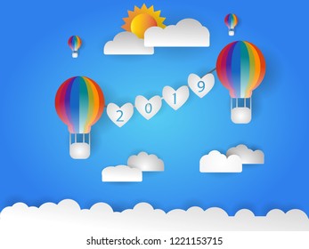 Hot Ballon fly in the sky with text 2019. Happy New year 2019