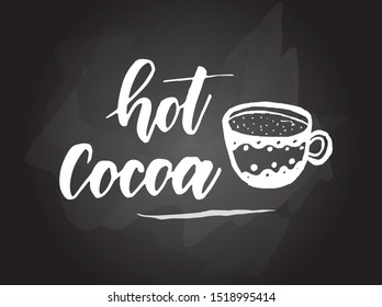 Hot cocoa - handwritten modern calligraphy handlettering typography on blackboard (chalkboard) background. With painted cup with cocoa. 