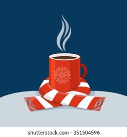 Hot coffee in red cup. Cup of coffee swathed in scarf. Winter background. Christmas card.