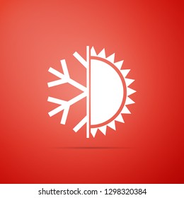 Hot and cold symbol. Sun and snowflake icon isolated on red background. Winter and summer symbol. Flat design. Vector Illustration