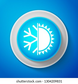 Hot and cold symbol. Sun and snowflake icon isolated on blue background. Winter and summer symbol. Circle blue button. Vector illustration